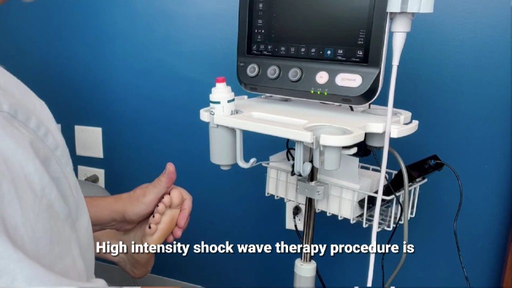 Dr. Staschiak doing a shockwave therapy procedure.