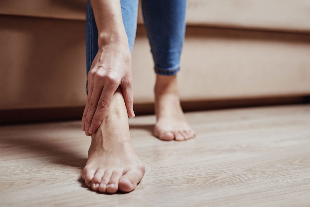 Woman having pain in the ankle.